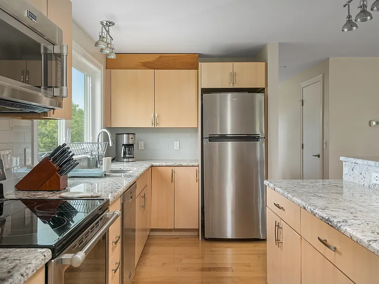 the kitchen and the open plan dining room