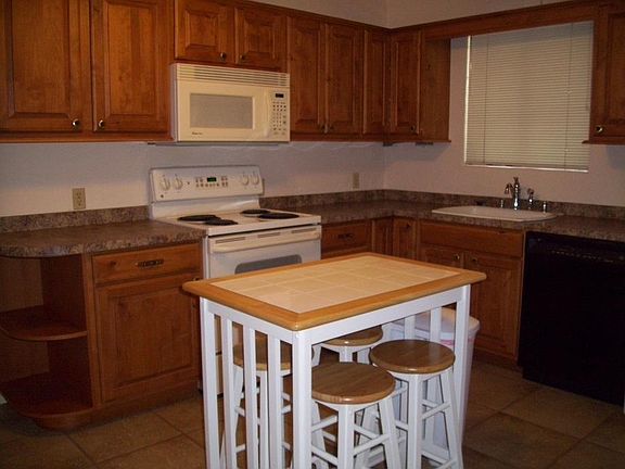 Kitchen opposite view; microwave; lots of storage