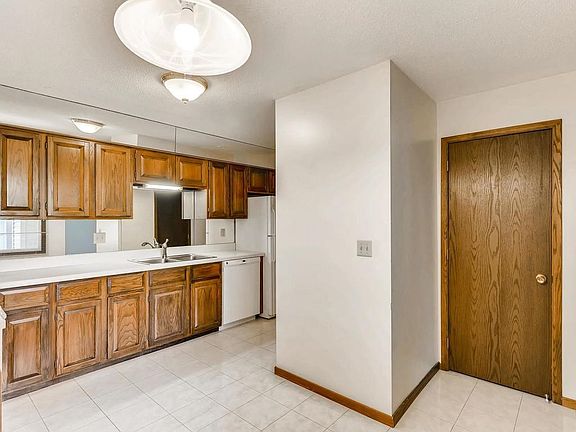 Kitchen boasts lots of cabinets and counters