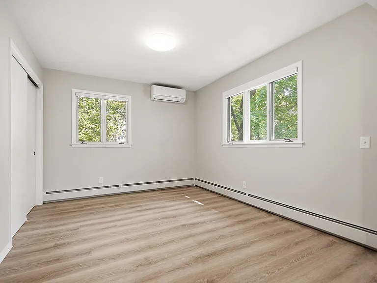 Open study attached to the main living room. This was originally built as the unit's 3rd bedroom (before space was opened up). Can be used as a study, TV den, or dining room.