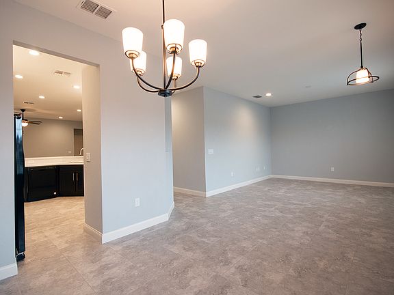 Welcome home to your versatile den and dining room