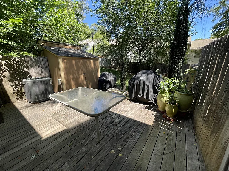 Back deck (opposite corner) with ample sized storage shed