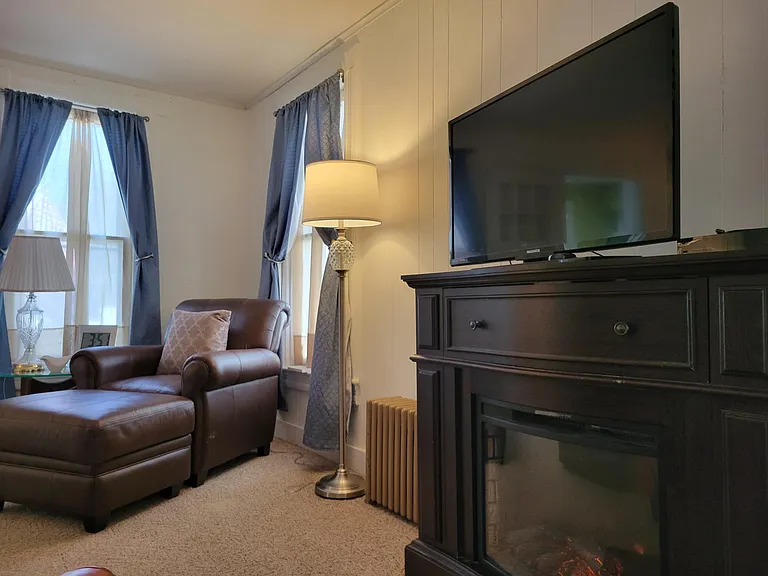 Living Room Electric Fireplace for ambiance and or heat. TV with Roku, Spectrum .. bring your passwords for other apps