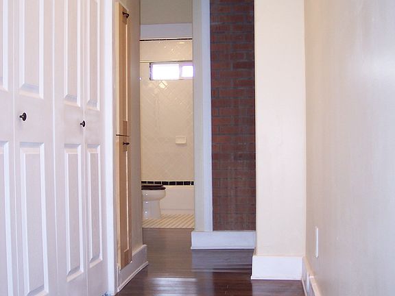 Hallway with New Oak Floors Leading Into the Bedrooms.