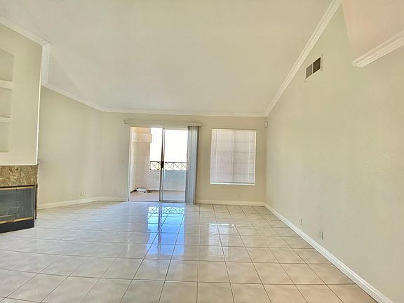 Living, dining area with balcony.