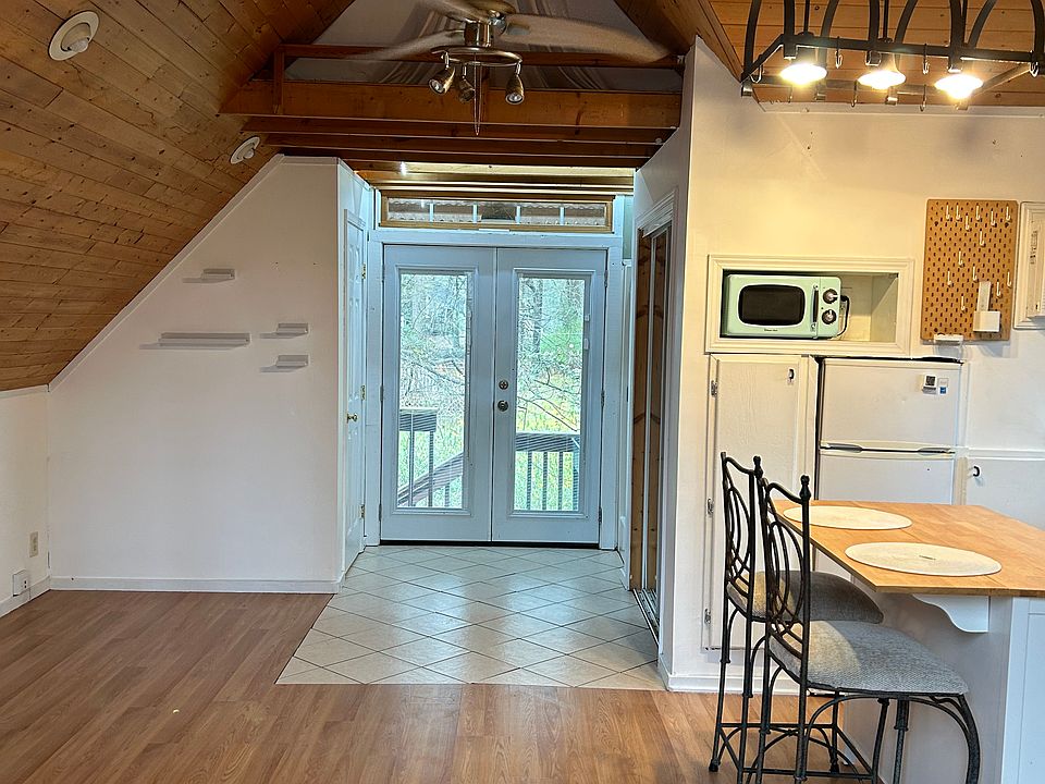 French doors to balcony deck into backyard
