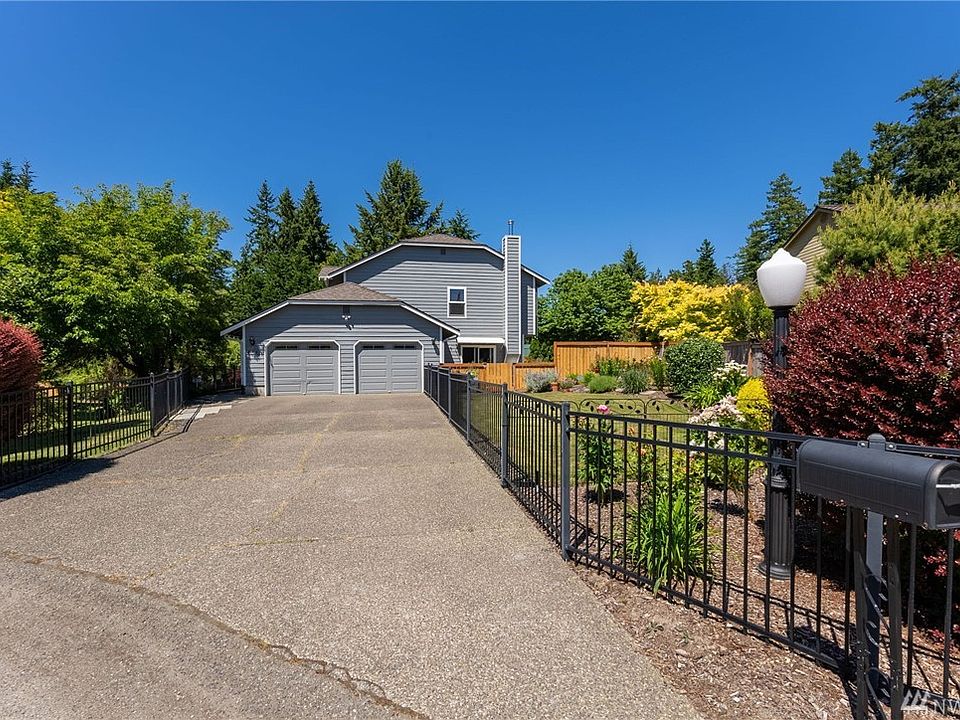 The house is set back from the street and the yards are fully fenced. 