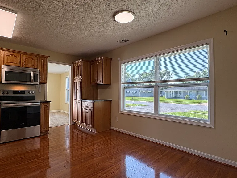 View of Eat-In Kitchen w/ Hardwood Floors