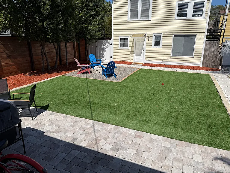 backyard with fire pit, pavers, seating, patio furniture