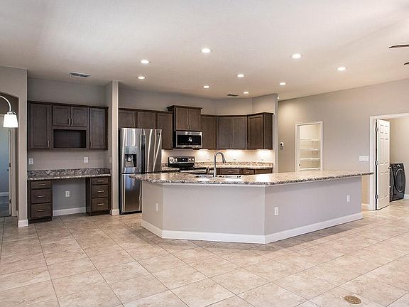 Gorgeous, open kitchen with a built-in desk and your choice of finishes - Wynter with Loft by Highla