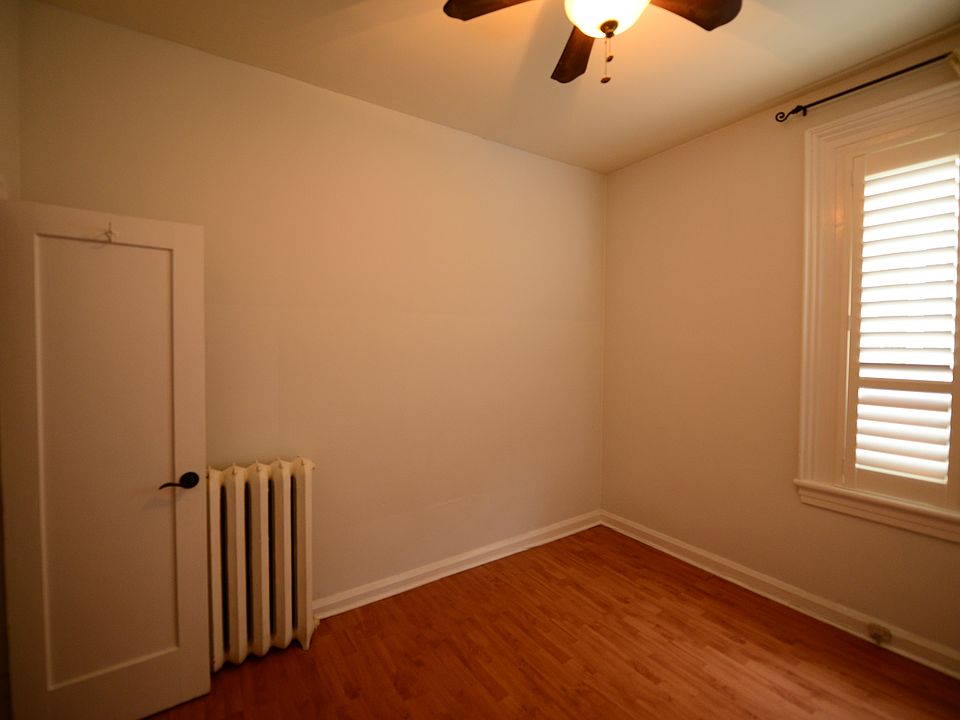 Bedroom with ceiling fan.