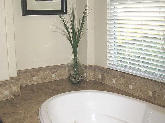 The jacuzzi tup with granite surround.