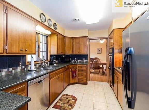 Granite countertops and stainless steel appliances dress up this kitchen nicely.