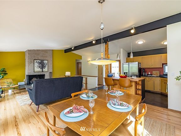 The open living room/dining room/kitchen floor plan makes for delightful entertaining opportunities. 