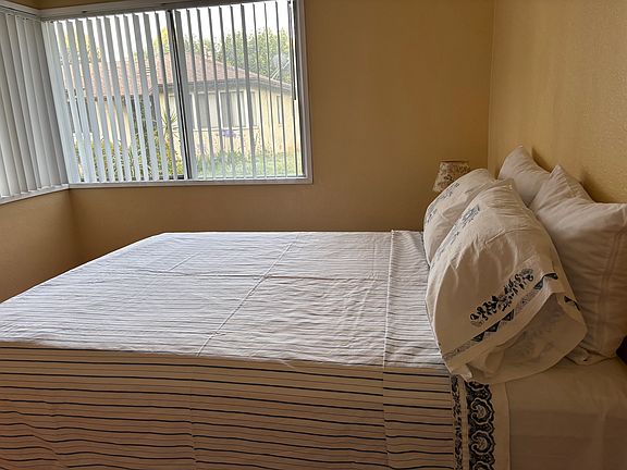 Bedroom with large window.