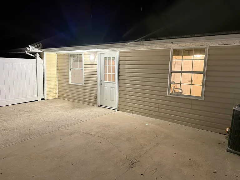 The great room and master bedroom face the private rear patio area.