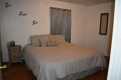 Front bedroom showing a king size bed can fit