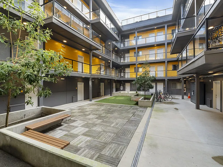 Visit with neighbors and guests in our interior community courtyard!