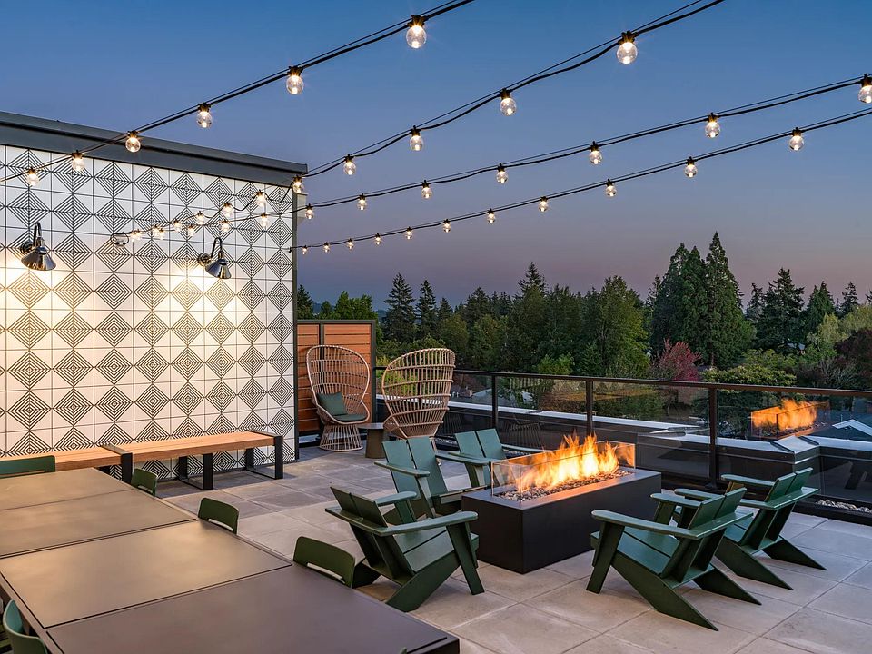 Cozy up at Modera Woodstock's outdoor terrace, complete with a welcoming firepit for year-round gatherings.