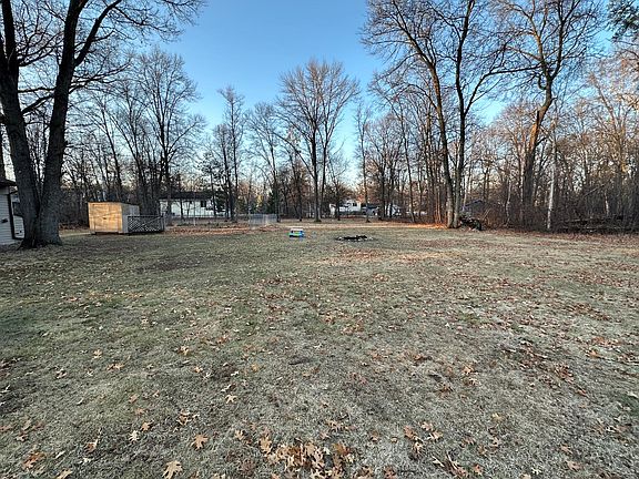 Beautiful back yard with fenced in garden area, and a small garden shed.