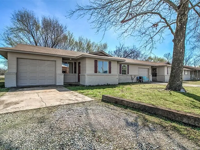 Front showing garage, driveway