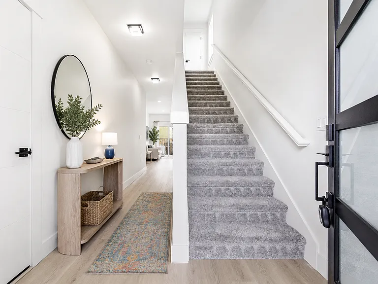Entry with extra wide hallway. 

Photos may include AI-generated virtual staging to help visualize the home's potential. Finishes and layout remain unchanged.