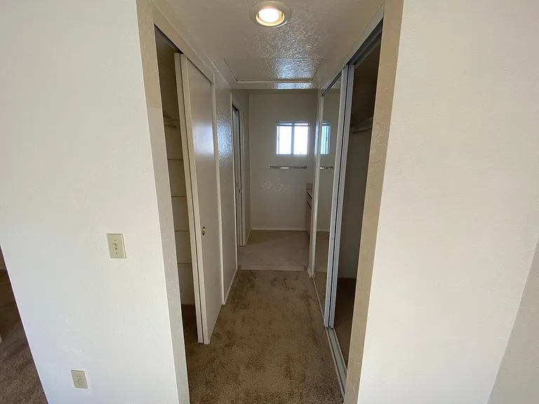 Bedroom 2: both closet doors