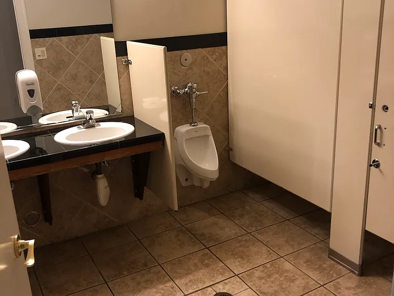 Conveniently located bathrooms located in Gym next to pool area.