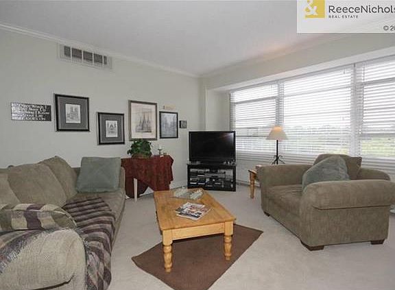 Living Room From Entry Hall.  Note Tree Tops Thru Windows.