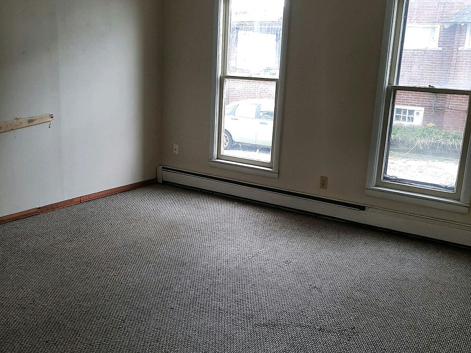 Bedroom with natural light (carpet replaced with new flooring)