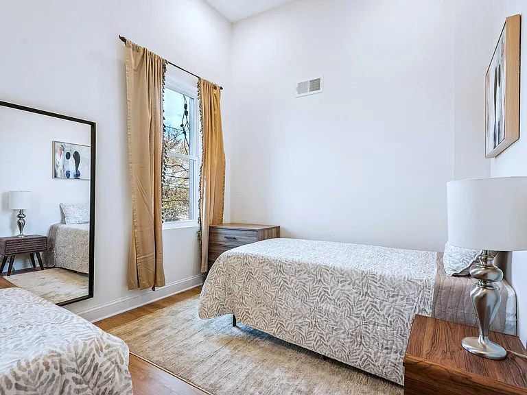 Front room with 2 twin beds - fits a King if combined