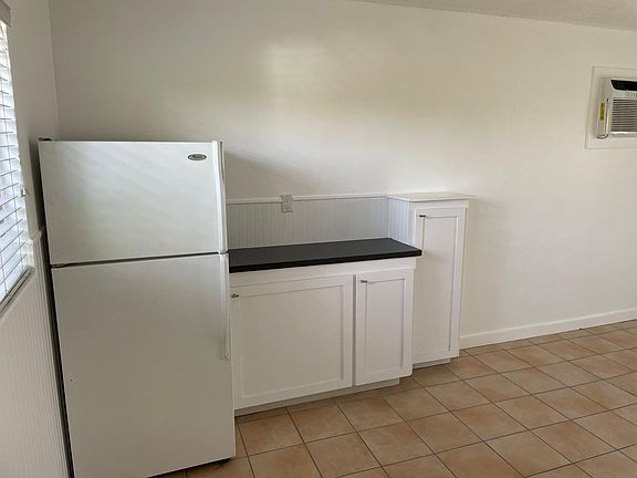 Full sized refrigerator and plenty of room for a Bistro table and chairs