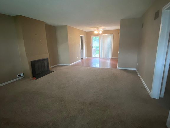 Living room to dining room; paint color has been updated to light grey.