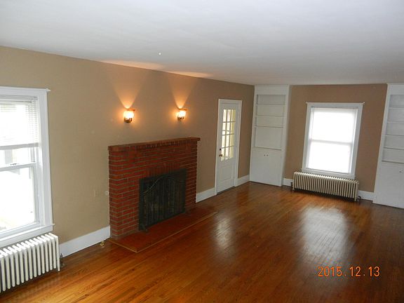 Living room with fireplace and built in cabinets