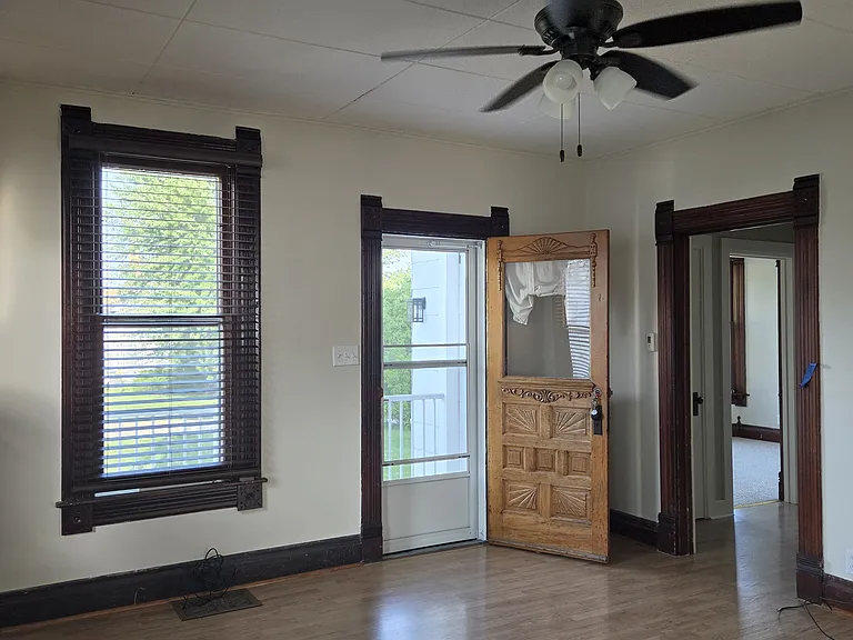 Living room with charming ornate entry door