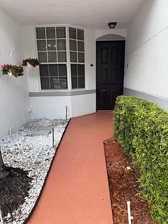 Main entrance, attached garage to the right.