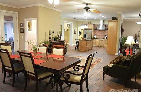 Entertaining is a breeze with an open concept floor plan. Beautiful ceiling fans and recessed lighti