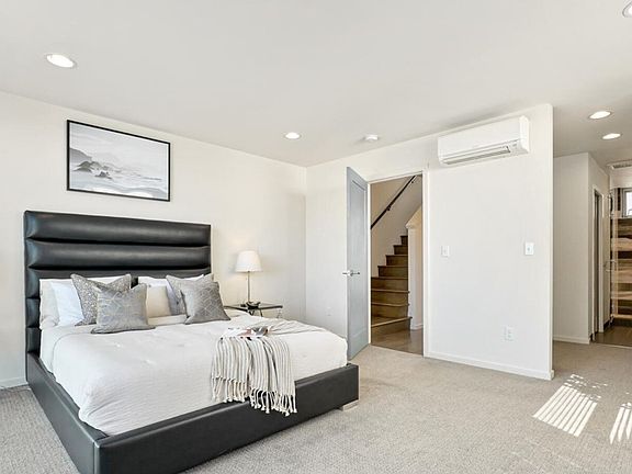 Primary bedroom, mini-split (heat/AC), and walk-in closet