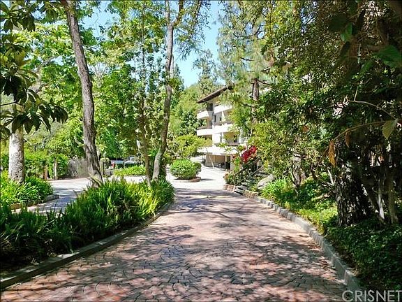 Lush landscaping and walking paths.
