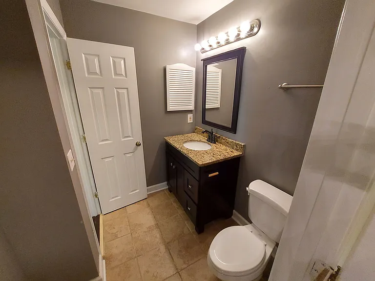 2nd Vanity serves as a second bath and powder room for guests.