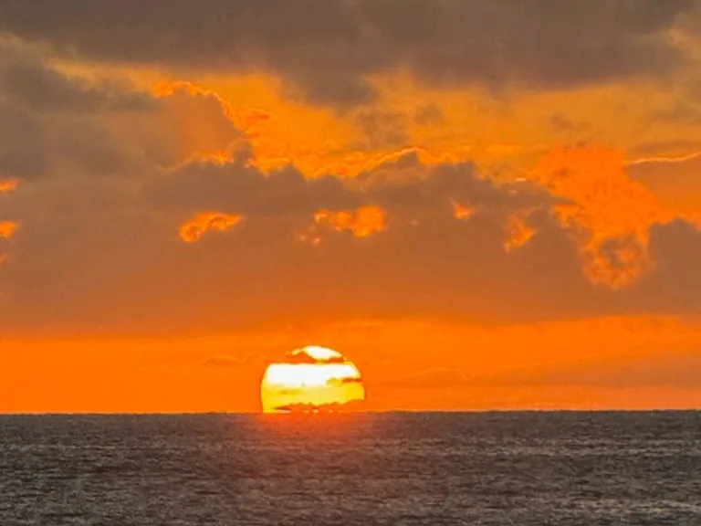 Enhance your life and watch a few kona sunsets. 
Can be seen from the home and lanais at certain time of year. Or just walk out to the lawn for views
