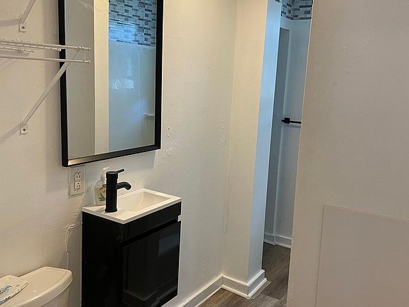 Updated bathroom with brand new sink vanity and flooring