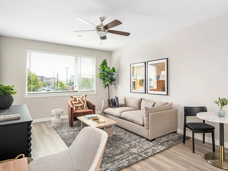 Finish Package II Living area with hard-surface vinyl plank flooring throughout and ceiling fan