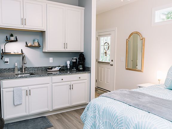 Everything you need to make quick meals. A 2 burner electric "stove top" is in bottom cabinet