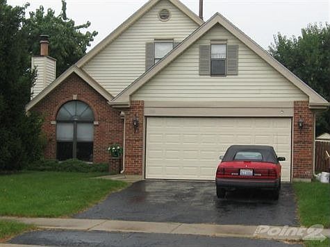 BRICK 2 STORY WITH 2 CAR ATTACHED GARAGE