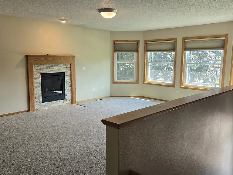 great room with gas fireplace upstairs
