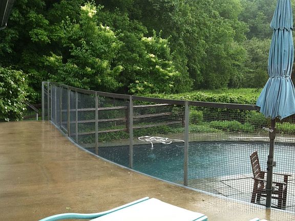 front deck overlooking pool on rainy day