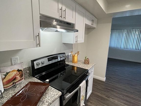 New kitchen reno new cabinets hard wood flooring, appliances. with a view of the back bay from your dining room window..