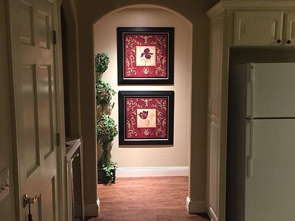 Kitchen hallway leading to 3rd bedroom and laundry room.