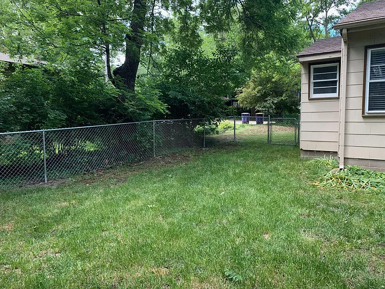 Southside of Fence and House